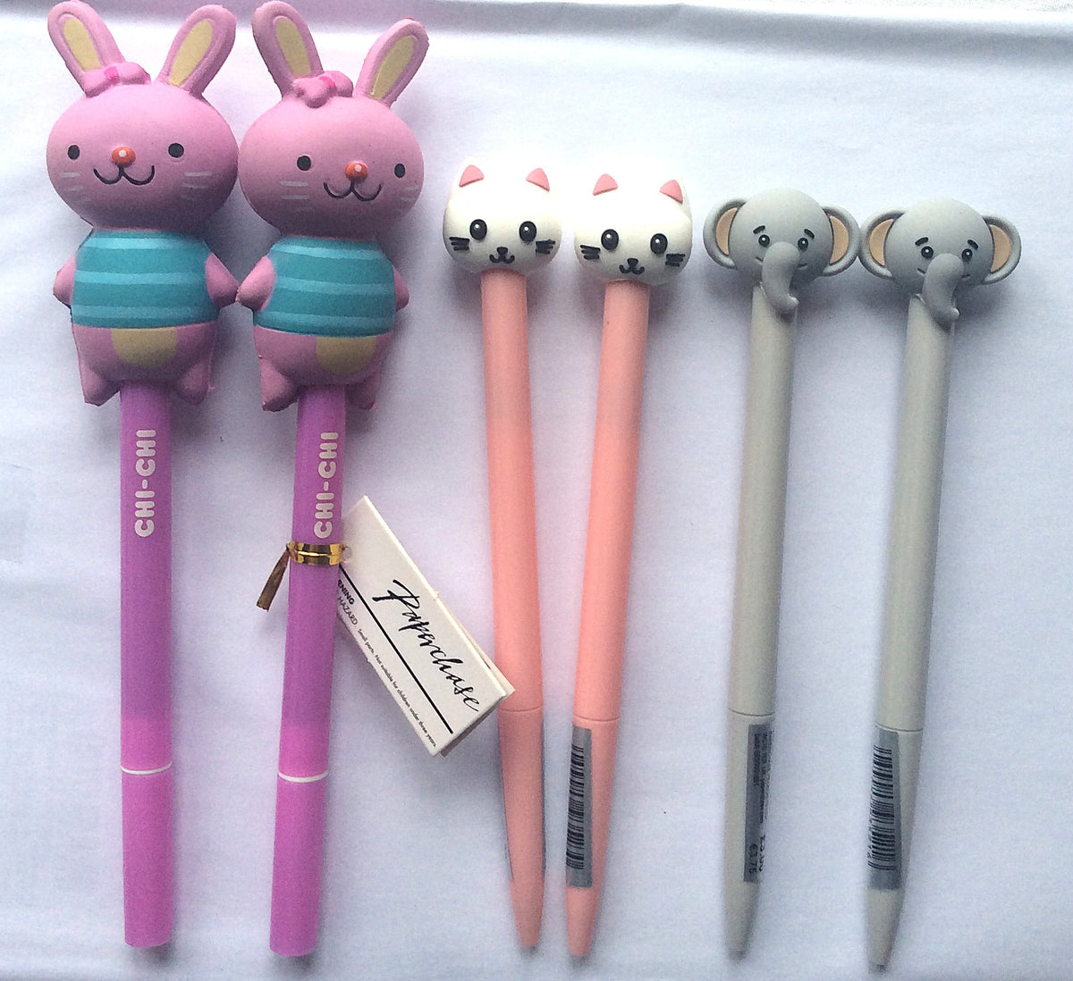 Close-up of two grey Paperchase elephant character pens