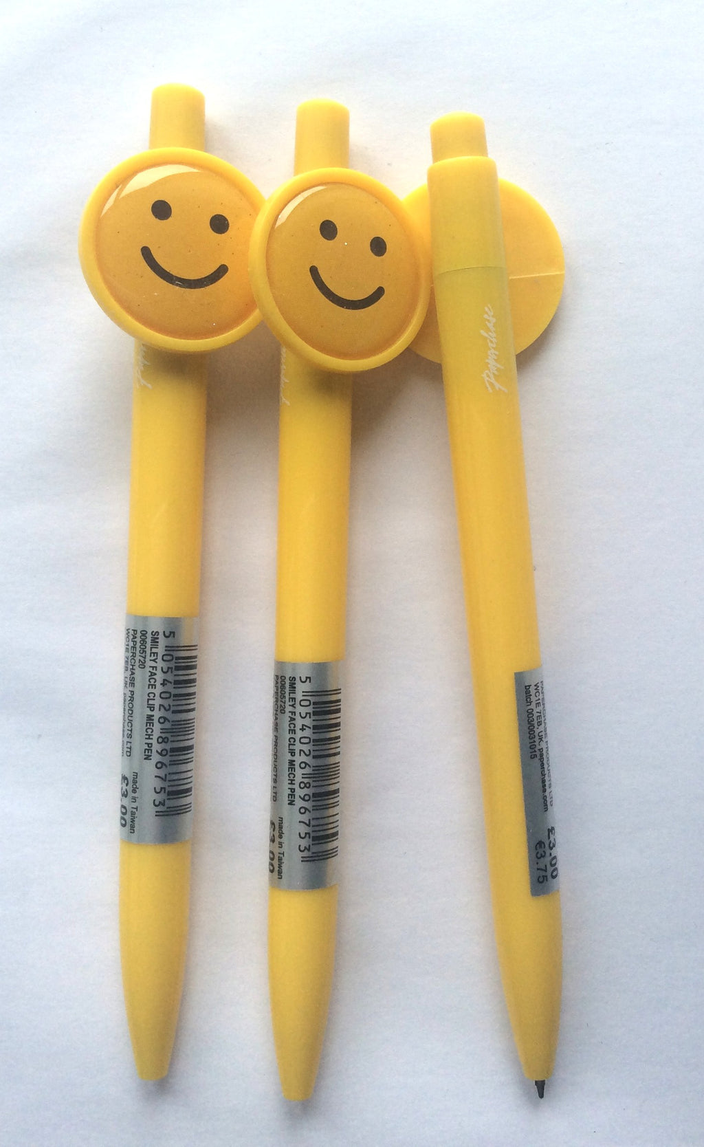 Close-up of yellow Paperchase smiley face ballpoint pens
