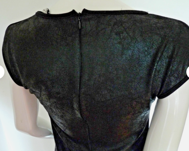 Close-up of the centre-back zip and crew neckline
