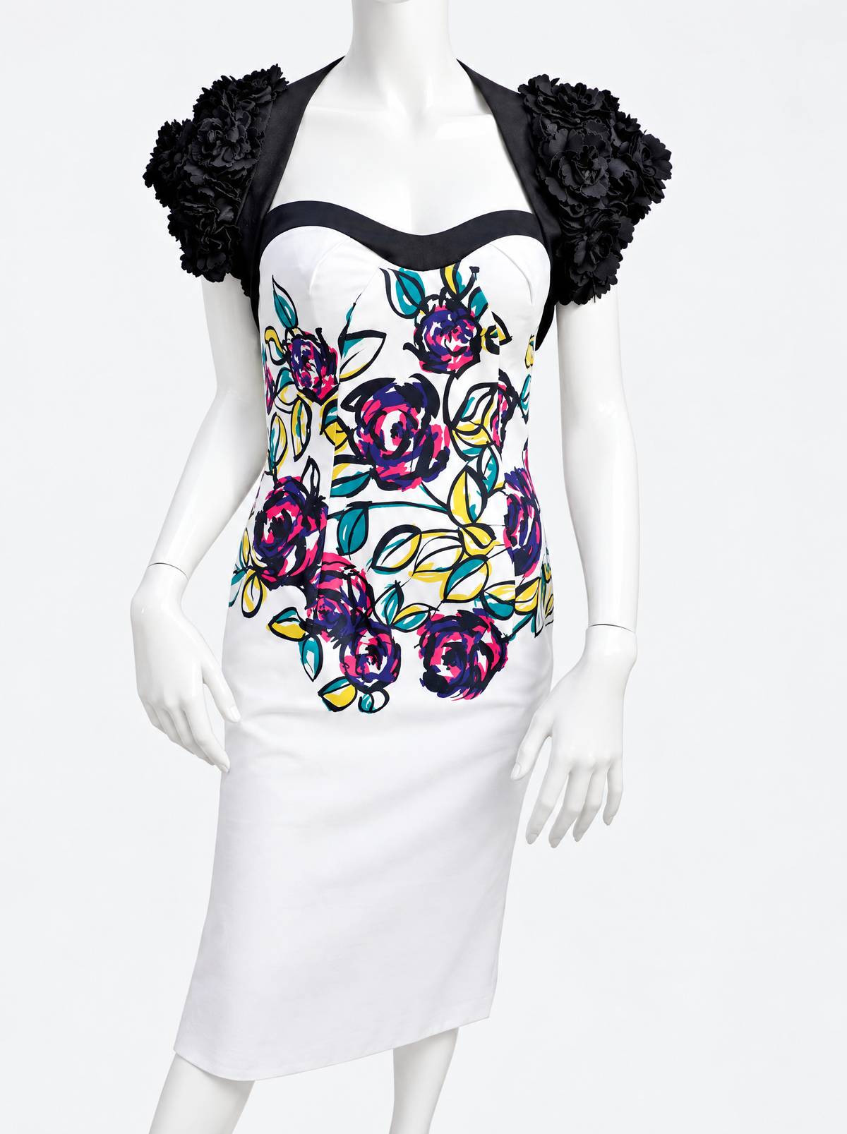 Close-up of the oversized 3D black fabric flowers on the shrug