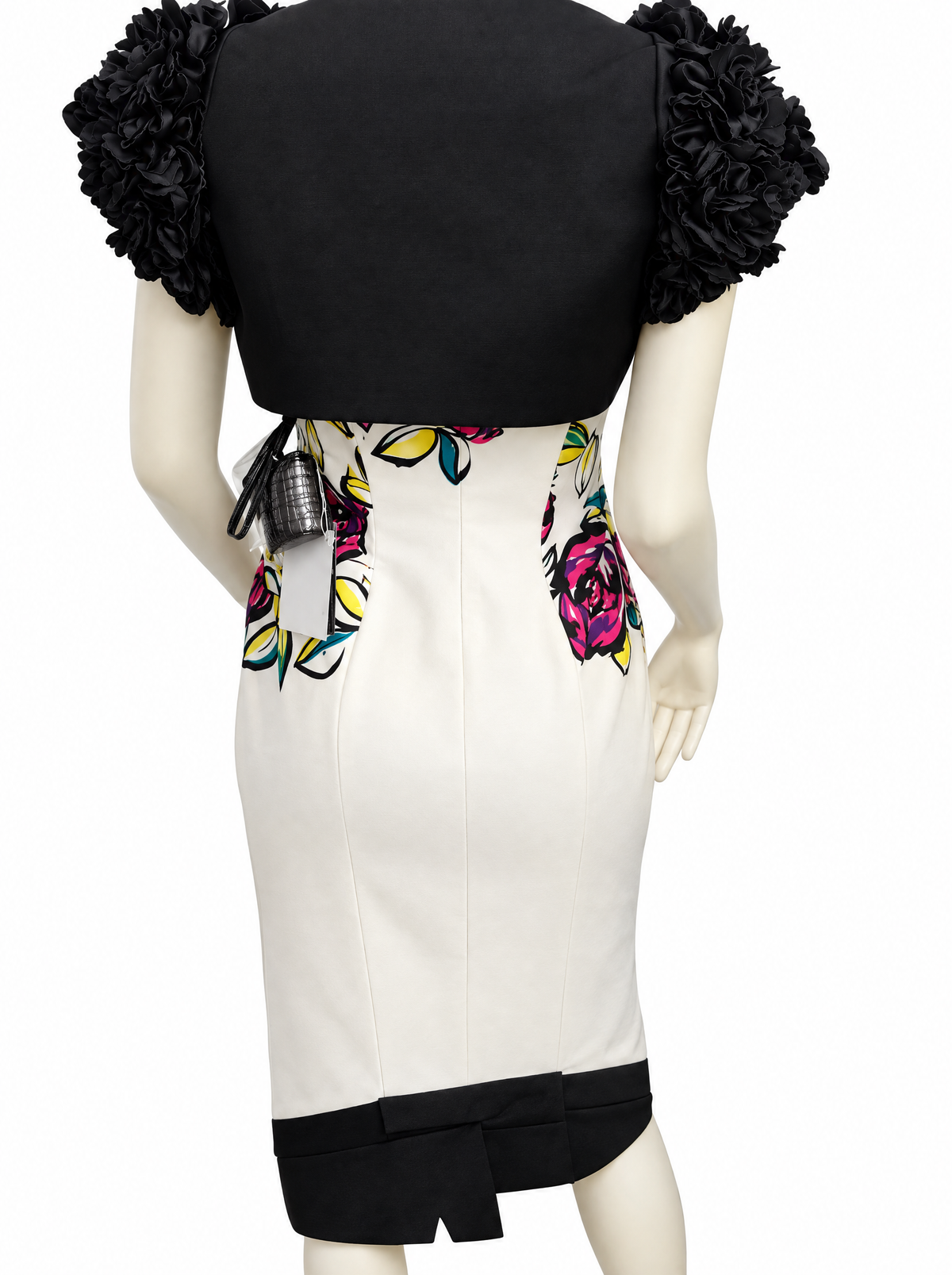 Close-up of the black satin fishtail and bow at the back of the dress