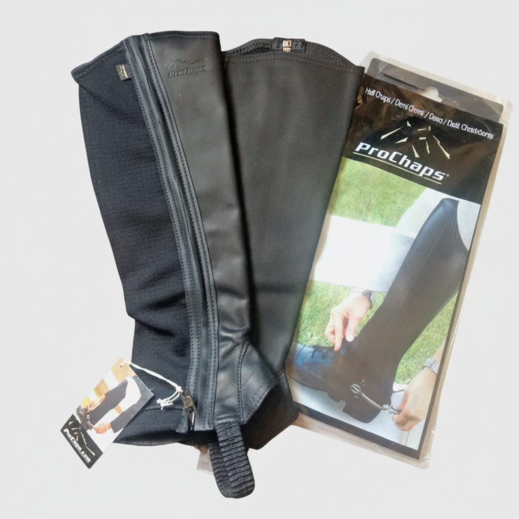 Black ProChaps leather and neoprene half chaps on a clean neutral background